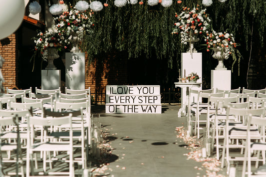 <a href="https://www.freepik.com/free-photo/stylish-elegant-white-wedding-aisle-chairs-stairs_1471439.htm#query=wedding%20signage&position=34&from_view=search&track=ais">Image by freepic.diller</a> on Freepik